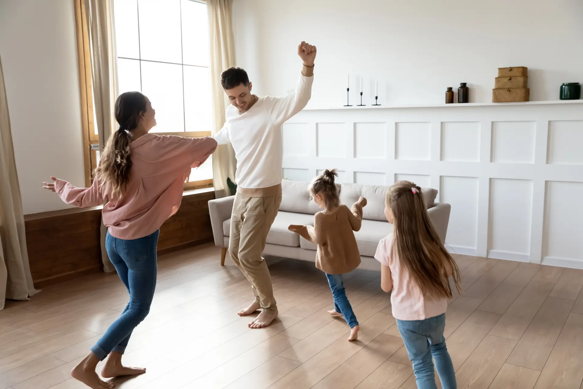 Happy couple cheering their successful new home purchase thanks to Prime Rate Mortgage ™