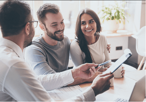 Happy couple cheering their successful new home purchase thanks to Prime Rate Mortgage ™